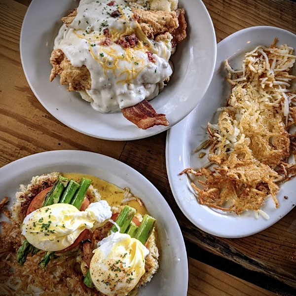 Eggs Benedict with hollandaise and hash browns